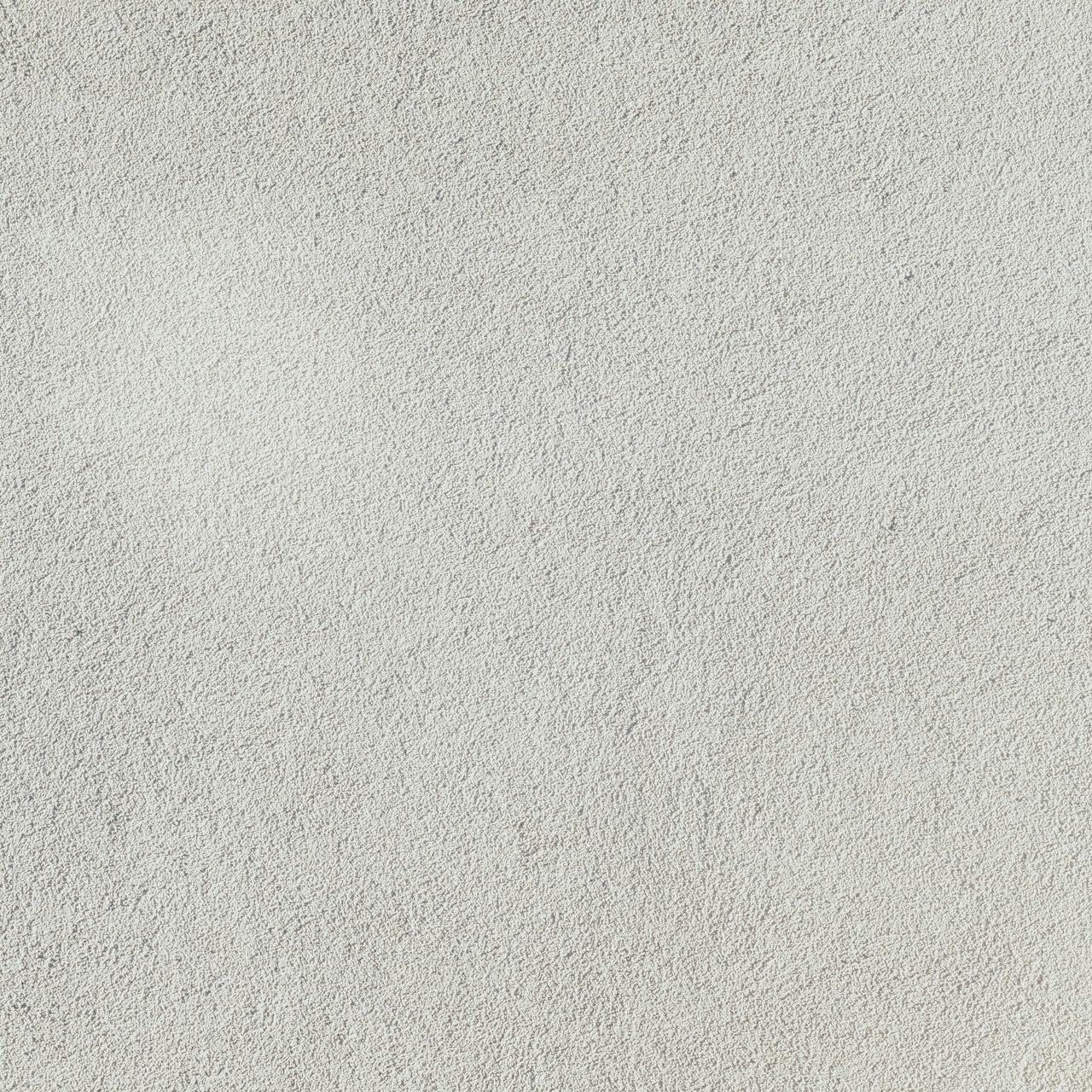 a close up of a white stucco wall